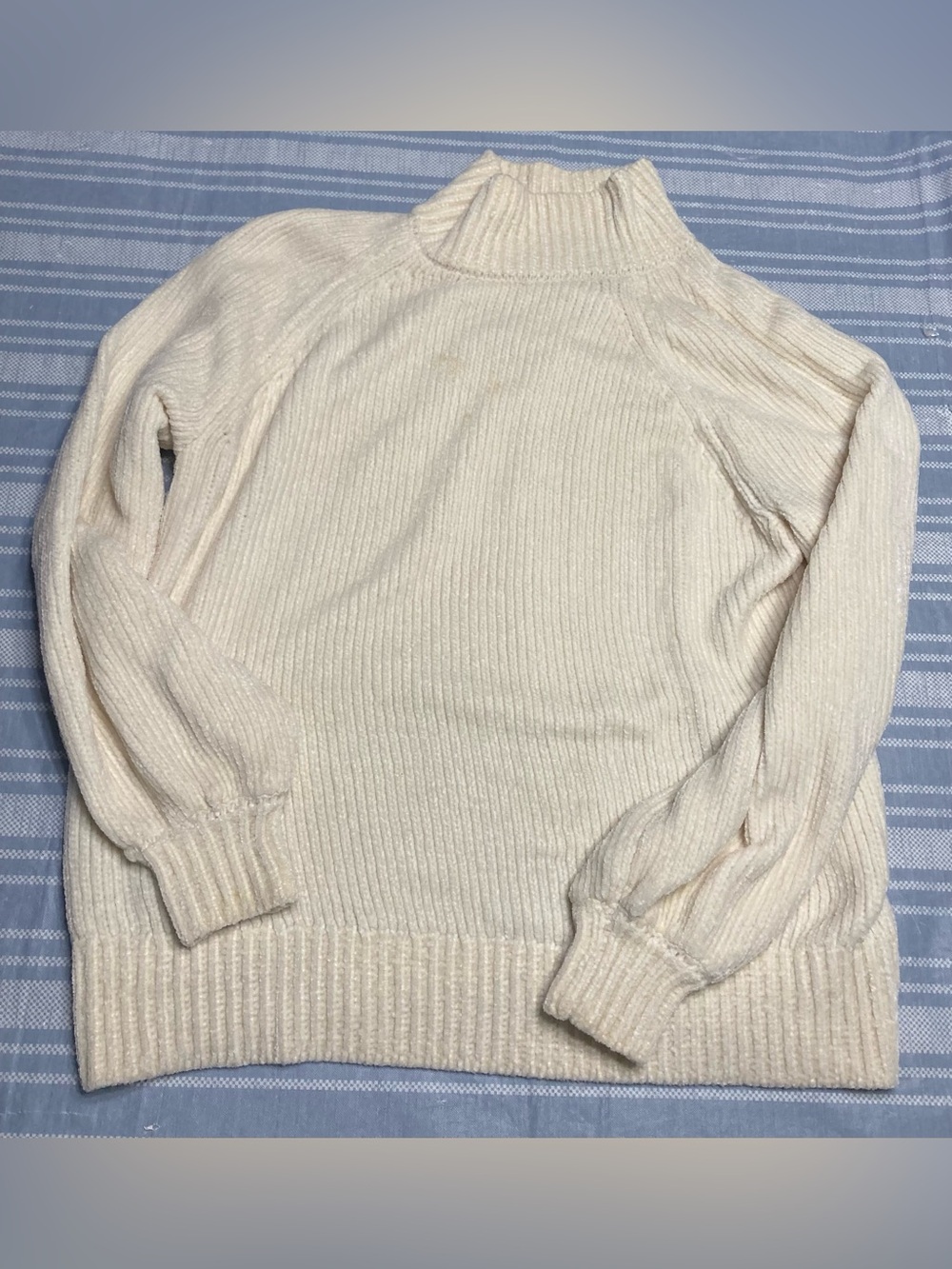 LOFT cream colored ribbed knit mock-turtleneck sweater.